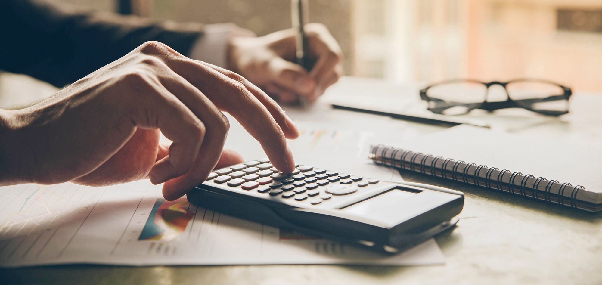 Man using a calculator