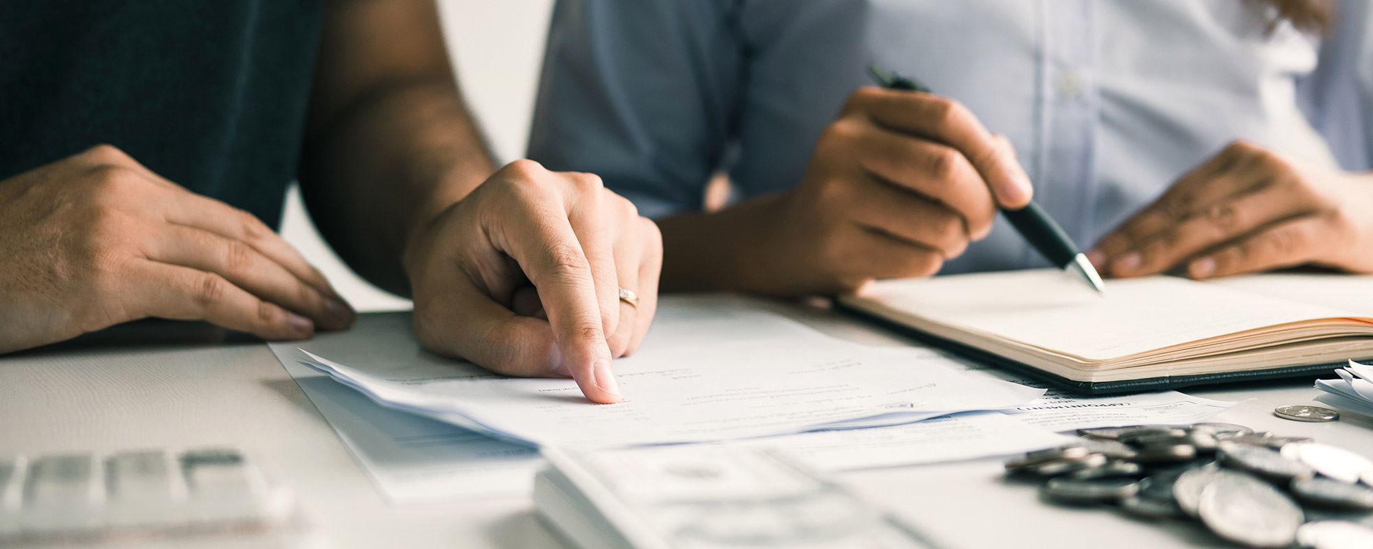 Several people doing paperwork